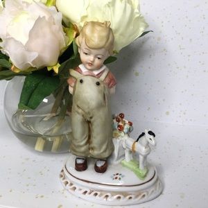 German Porcelain Figurine of Boy with toy horse and cart